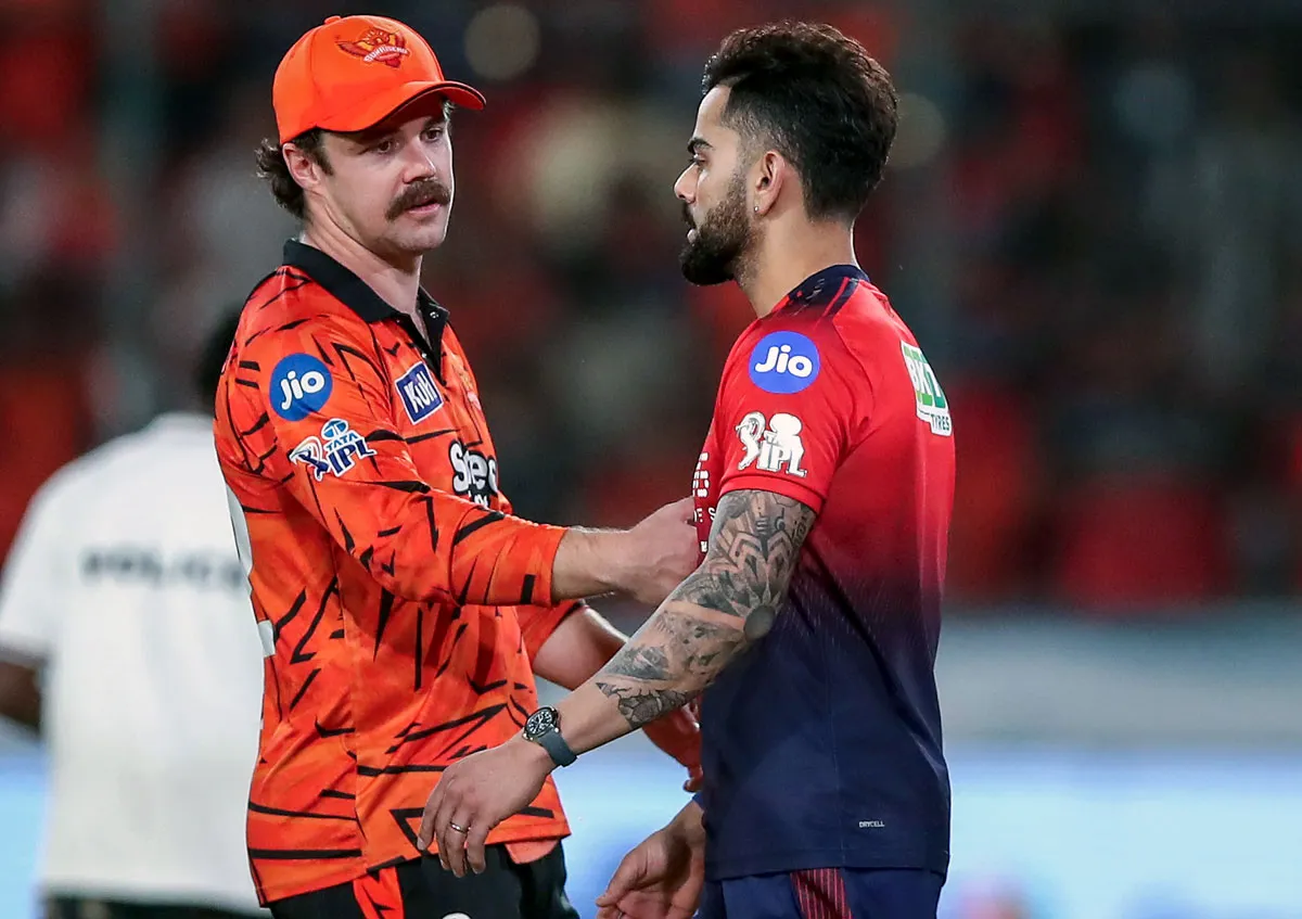 Virat Kohli and Travis Head during a tense IPL 2026 post-match moment that sparked handshake controversy discussions.