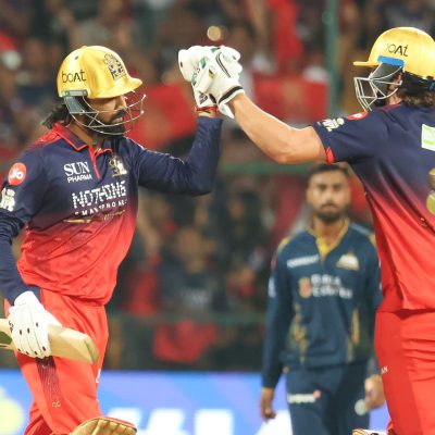 Gujarat Titans and Royal Challengers Bengaluru players in action highlighting Ahmedabad pitch, weather, and key player battle in IPL 2026.